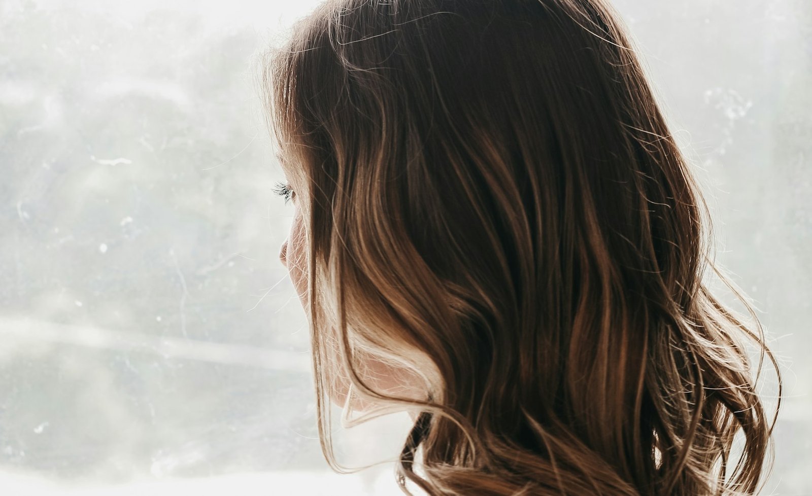 Woman looking out of a window